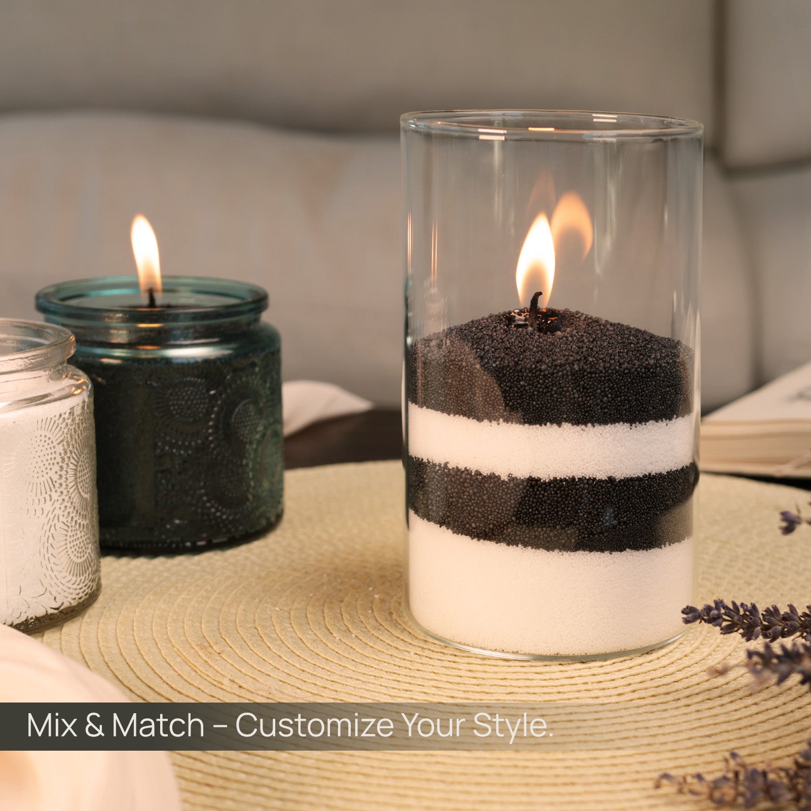 Tula’s customizable black and white sand candle layered in a glass container — refillable, plant-based, and perfect for creative home decor and gifting.